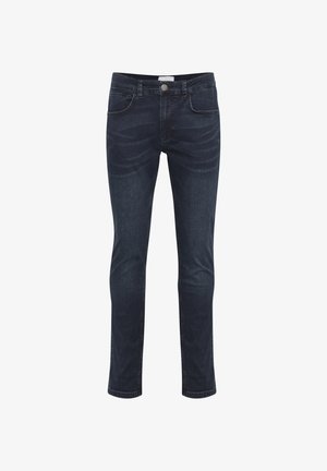 Tumedat sinised kitsad teksad, millel on esine nööp, lukku ja viie-tasku disain, eksponeeritud valgel taustal.