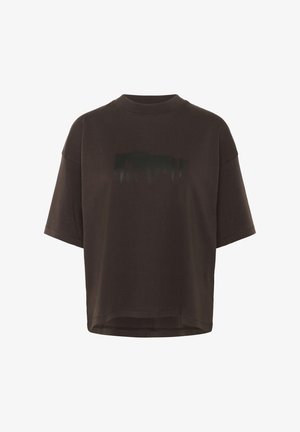 Brown oversized t-shirt with a textured black graphic print. Features a high neck and short sleeves, made from soft cotton fabric.