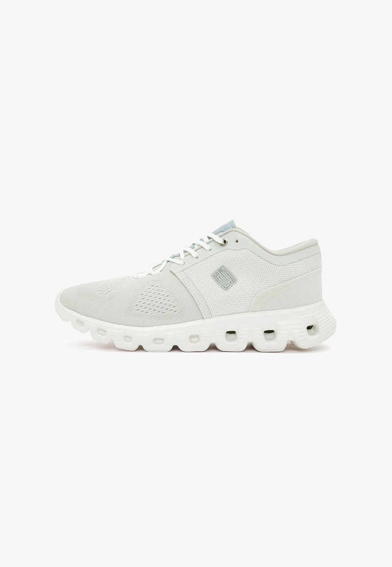 Light gray athletic shoe with a mesh upper, rubber sole, and textured accents. Features white laces and a logo on the side.