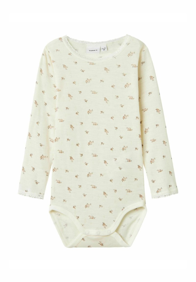 Langarm-Babybodysuit in hellgelb mit kleinem Blumenmuster. Hergestellt aus weichem Stoff, mit Spitzenbesatz und Druckknöpfen am Boden.