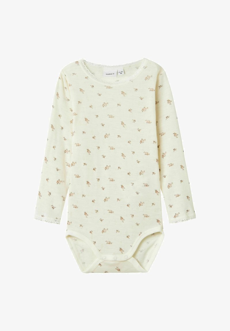 Bodysuit à manches longues pour bébé en jaune clair avec un petit imprimé floral. Fabriqué en tissu doux, il est orné d'une bordure en dentelle et de boutons-pression au bas.