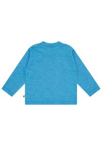 Langärmliges Hemd in Hellblau, aus strukturiertem Baumwollstoff. Mit Rundhalsausschnitt und geradem Schnitt, versehen mit genähten Säumen. Etikett an der Seite sichtbar.