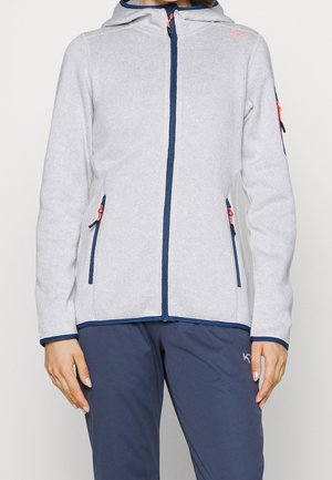 Giacca zip-up grigia in tessuto con cappuccio, dettagli blu navy e due tasche laterali. Presenta una finitura testurizzata e dettagli vivaci della cerniera.