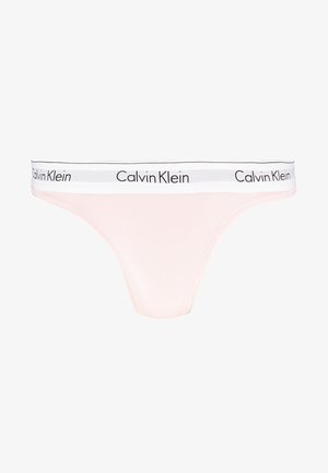 Calvin Klein pink thong underwear with white elastic waistband featuring black logo text. Smooth fabric with seamless design and minimal coverage.