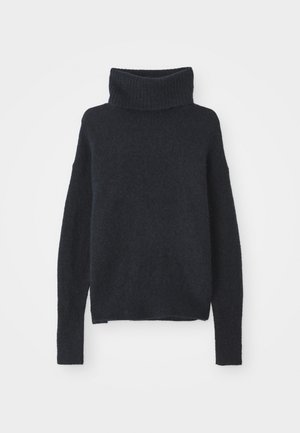 Dark blue turtleneck sweater made of soft, textured fabric. Features long sleeves, a loose fit, and ribbed detailing at the collar and cuffs.