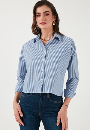 Blue and white striped button-up shirt with a collar, long sleeves rolled at the cuffs, and a chest pocket. Made from a lightweight fabric.