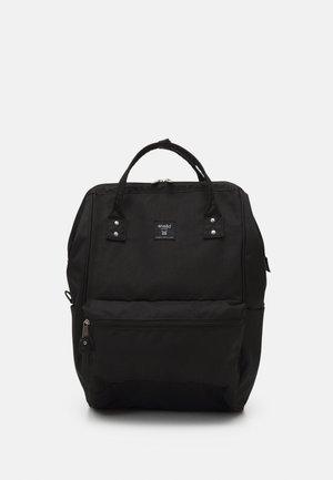 Black rectangular backpack with two top handles, front zippered pocket, and Anello brand label centered near the top.