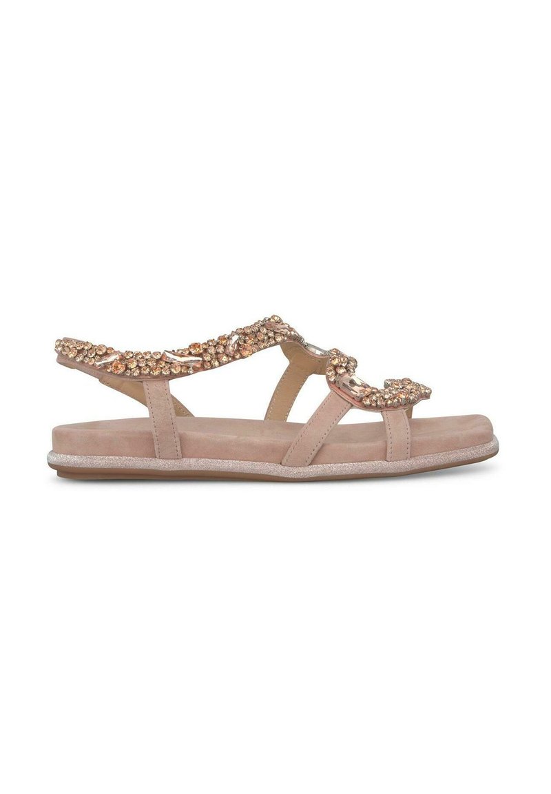 Sandali piatti nude con cinturini decorati e scintillanti, realizzati in morbida pelle scamosciata, con suola sagomata e un sottile accento luccicante.