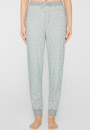 Pantalon de pyjama gris clair à motif d'étoiles blanches, taille élastique avec cordon de serrage et poignets gris aux chevilles, fabriqué en matériau doux.