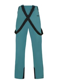 Pantalones impermeables en color verde azulado con tirantes negros ajustables, piernas rectas y acentos negros en los tobillos. Tela suave y resistente.