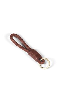 Braided brown leather keychain with metal ring and embossed "HOWARD" patch. Features a textured surface for grip and durability.