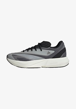 Athletic shoes in gray and black, featuring a sleek design, smooth synthetic upper, mesh accents, and a light foam midsole labeled "LIGHTSTRIKE."