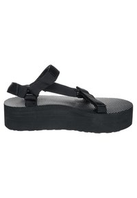 Black platform sandals featuring a textured rubber sole, thin fabric straps, and an adjustable back strap for secure fit.