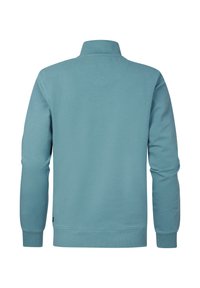Sweatshirt bleu clair, tissu doux, manches longues, col haut, poignets et ourlet côtelés, texture lisse, design minimaliste, sans motifs visibles.