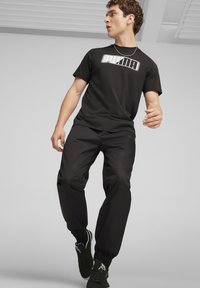 Puma Tepláky - black