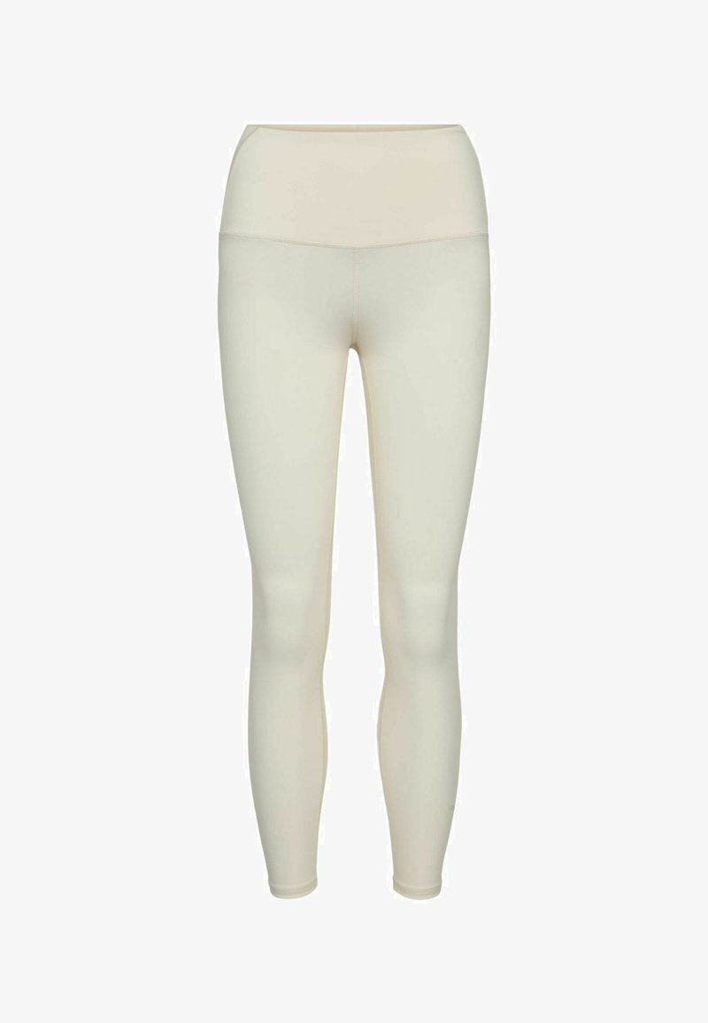 Leggings beige clair taille haute longueur totale avec tissu lisse et coutures plates, présentés sur fond blanc.