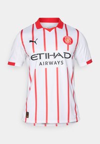 Maillot de football blanc avec des rayures verticales rouges, un col rouge, et le logo PUMA. Affiche "ETIHAD AIRWAYS" en noir sur la poitrine.