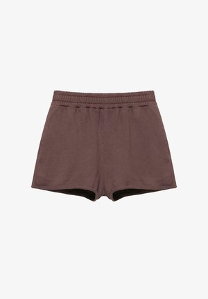 Hnedé elastické nohavice s elastickým pásom, voľným strihom a bez viditeľných vzorov či ozdôb.