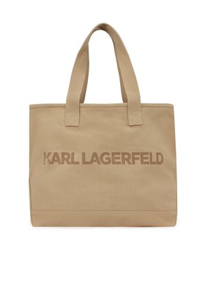 Sac fourre-tout en tissu beige avec deux poignées et l'inscription "KARL LAGERFELD" imprimée sur le devant dans des tons beige assortis.