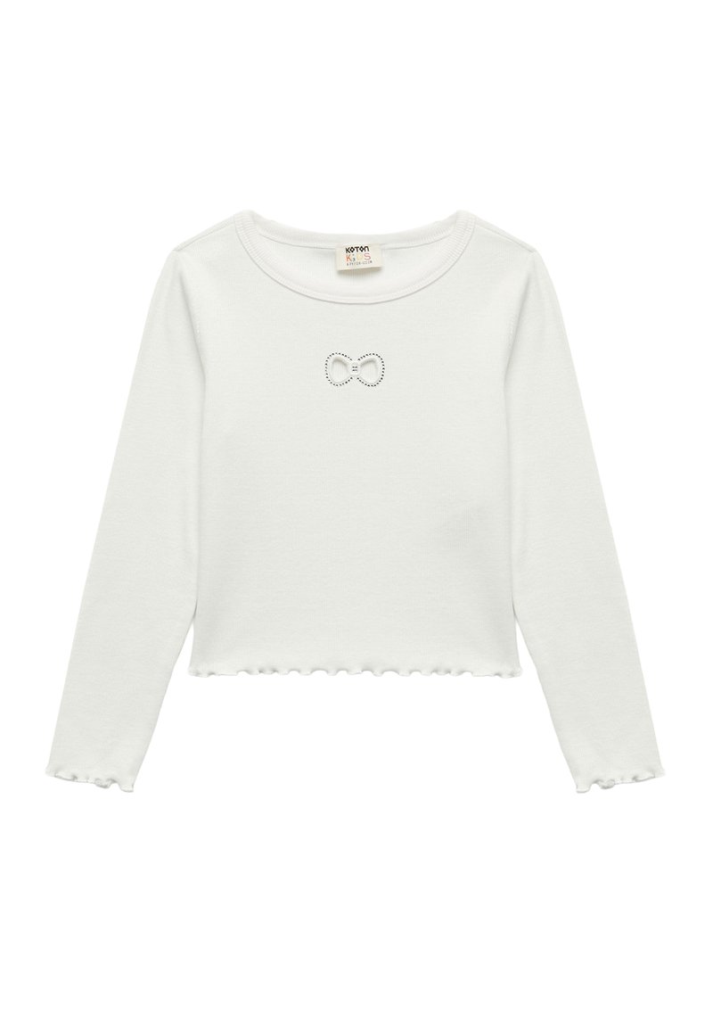 Witte lange mouwen crop top met een gerimpelde zoom, voorzien van een klein strikontwerp in rhinestones op de borst. Zacht katoen materiaal.