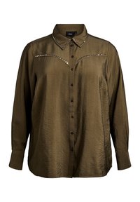 Olive green blouse with long sleeves, button-up front, embellished collar and shoulder detailing with metallic studs. Soft, textured fabric.
