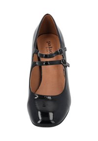Black patent leather Mary Jane shoe with two adjustable straps, rounded toe, and a smooth interior. Flat heel, minimalistic design features.