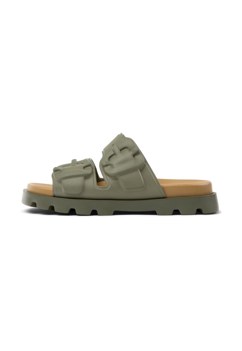 Green rubber slide sandals with two adjustable straps featuring molded pockets, brown cushioned footbed, and textured sole for traction.
