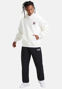 Fila LUGANO - Pantalones deportivos - black