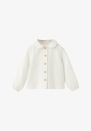 White ribbed button-up shirt with long sleeves, a rounded collar, and wooden buttons down the front, featuring a textured fabric.
