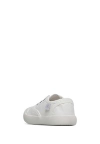 White canvas sneaker with a rubber sole, rounded toe, and black laces. Features a small gray logo patch on the side and textured sole.