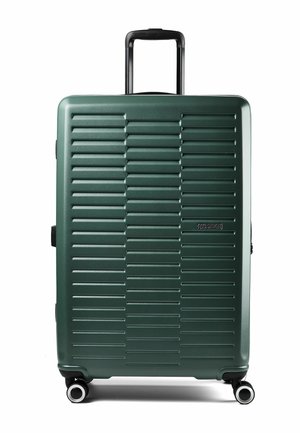 Grande valigia rigida verde scuro con scanalature orizzontali, quattro ruote girevoli e manico telescopico nero.