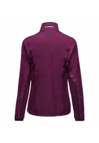 Fuchsia jacket with a high collar, long sleeves, and reflective accents. Smooth fabric with a matte finish and a slim fit design.