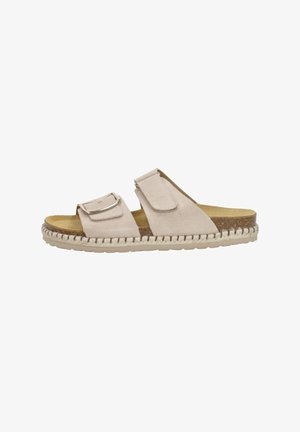 Beige slide sandal with two adjustable straps, a buckle, and a textured footbed. Features a woven jute midsole and a solid rubber outsole.