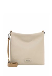 Beige leather crossbody bag with a textured finish, curved top, and a detachable strap. Features a metallic logo accent on the front.
