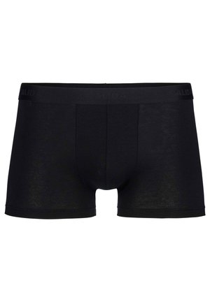 Zwarte katoenen boxershorts met een zwarte elastische tailleband waarop de merknaam "CALIDA" is gegraveerd. Slecht textuur, aansluitende pasvorm, middellange lengte tot de dij.