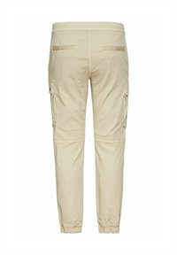 Beige Cargo-Hosen mit elastischem Bund, zwei seitlichen Cargo-Taschen und elastischen Bündchen an den Knöcheln. Glattes Material mit einem schlichten Design.
