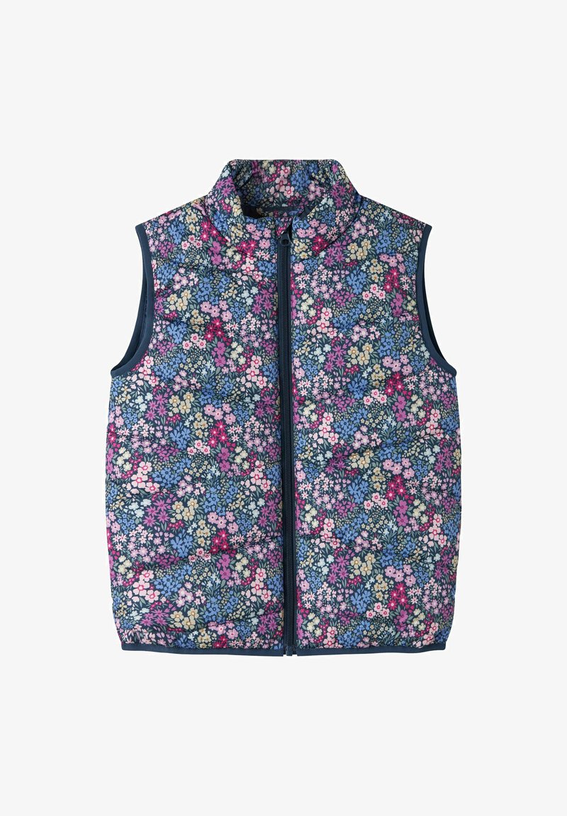 Gilet trapuntato senza maniche con zip, decorato con un fitto motivo floreale che presenta fiori rosa, viola, blu e crema su uno sfondo scuro.
