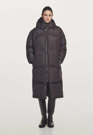 Black puffer coat with a zip front, large hood, and side pockets. The collar is high, and the coat features a quilted design for insulation.
