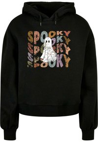 Musta huppari, jossa on valkoinen aavegrafiikka ja toistuva sana "SPOOKY" kuluneen näköisellä monivärisellä typografialla. Puuvillasekoitemateriaali.