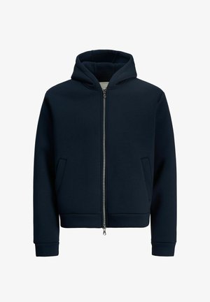 Sweat à capuche zippé bleu marine avec capuche, poches latérales, poignets côtelés et doublure intérieure douce. Fabriqué à partir d'un matériau lisse et extensible.