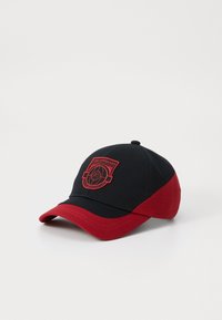Black and red baseball cap featuring an embroidered logo, curved brim, and six-panel design with a smooth cotton texture.