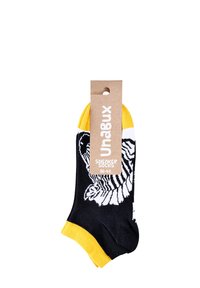 Calze da ginnastica nere con grafica di una tigre bianca, bordo giallo e etichetta con informazioni su marca e taglia. Texture in maglia morbida.