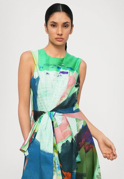 Sleeveless dress with a colorful, abstract print in green, blue, pink, and black. Features a wrapped waist with a tied detail. Smooth fabric.