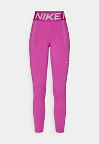 Leggings sportivi rosa con una fascia alta che mostra "NIKE". Presentano pannelli in mesh traspirante sui lati e una texture liscia.