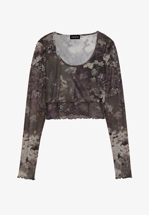 Dugih rukava skraćeni top od prozirnog sivog materijala s cvjetnim uzorkom. Ima okrugli izrez i valoviti rub. Mekana i lagana tekstura.