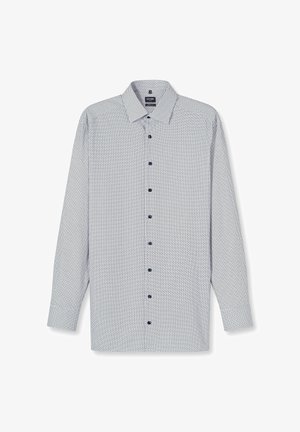 Chemise à manches longues blanche et marine avec un motif géométrique. Dotée d'une patte de boutonnage, d'un col et de boutons bleus. Matière en coton.