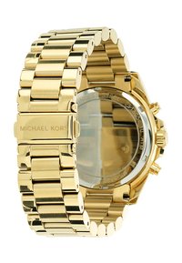 Orologio in acciaio inox dorato con design a bracciale a maglie. Presenta una cassa rotonda, un fondello trasparente e un marchio inciso sulla chiusura.