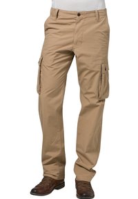 Kaki cargobroek van katoen, met zijzakken, een losse pasvorm en een knoopsluiting. Bruine veterlaarzen zijn onderaan zichtbaar.