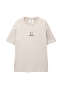 Beige bomulds t-shirt med korte ærmer og rund hals. Har et sort Honda-logo trykt centralt på brystet. Casual fit.