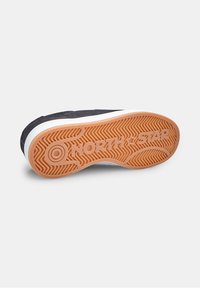 Rubber sole with a textured pattern, featuring "NORTH*STAR" branding. Upper made of dark material with a smooth finish and white trim.